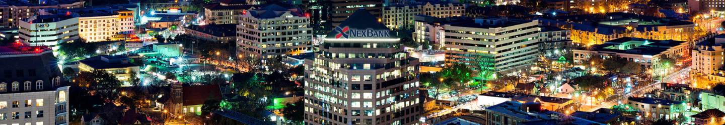 uptown NexBank building at night