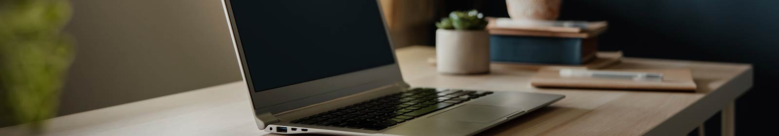 a laptop computer sitting on a table